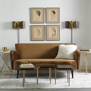 An upscale sofa and tables in browns.